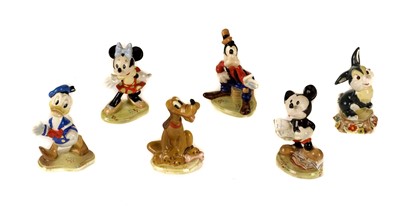 Lot 295 - Beswick. A set of six Walt Disney pottery figures each with gold stamp