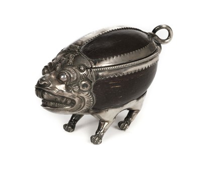 Lot 66 - Tibetan. A 19th century silver and coconut "monster" casket