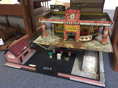 Lot 336 - Repair Garage. A toy garage c.1930 plus one other