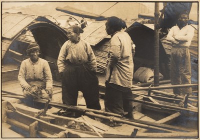 Lot 312 - China. Four Chinese people on a sampan in China, by Sam Sanzetti, carbon print, 1930s