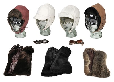 Lot 305 - Motoring Apparel. A collection of leather helmets and gloves