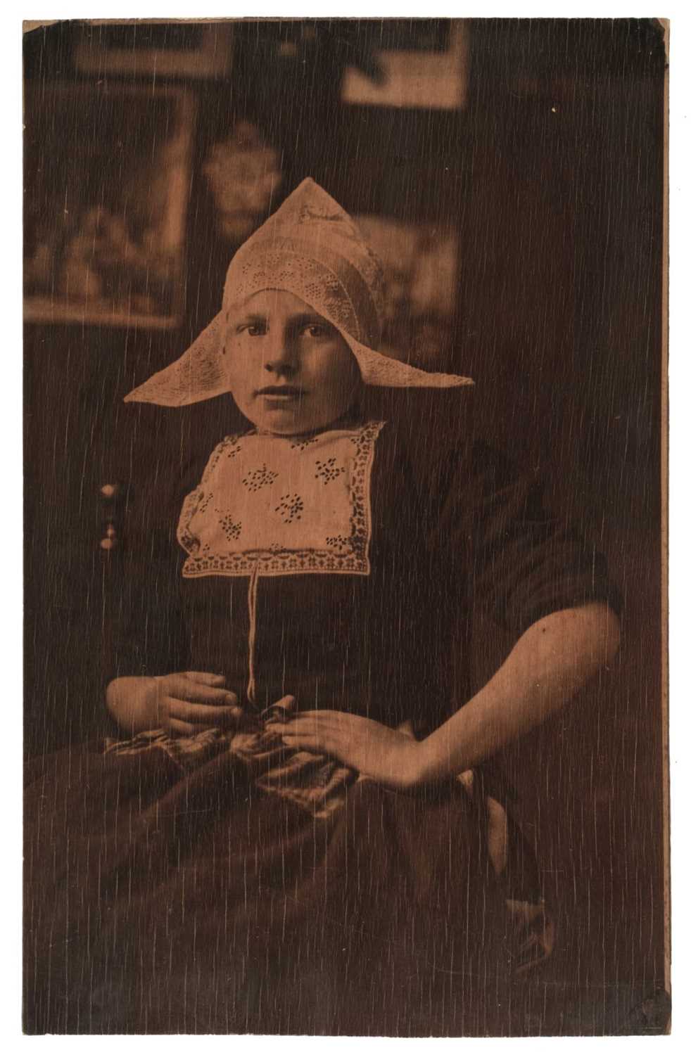 Lot 42 - Dutch School. Portrait of a Dutch girl in traditional dress, early 1900s, carbon print