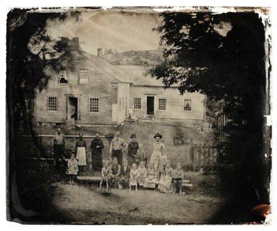Lot 119 - Ambrotype. A three-quarter plate ambrotype of an American family outside their home, c. 1865