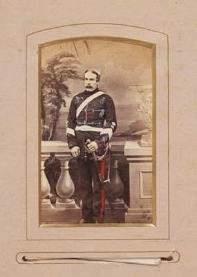 Lot 204 - Miltary Officers. An album containing 10 cabinet cards and 70 cartes de visite