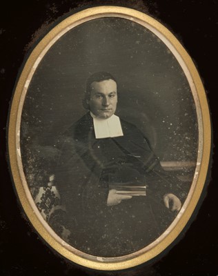 Lot 121 - Daguerreotype. A large half-plate daguerreotype of a priest, photographed by Millet, c. 1850