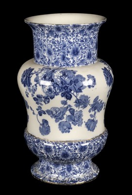 Lot 139 - Doulton Burslem. A blue and white pottery umbrella vase circa 1900