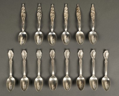 Lot 54 - Tiffany & Co. A set of 8 silver teaspoons and other items