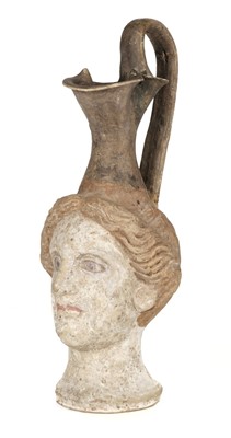 Lot 187 - Roman. A Roman terracotta female head ewer