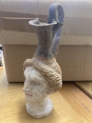 Lot 187 - Roman. A Roman terracotta female head ewer