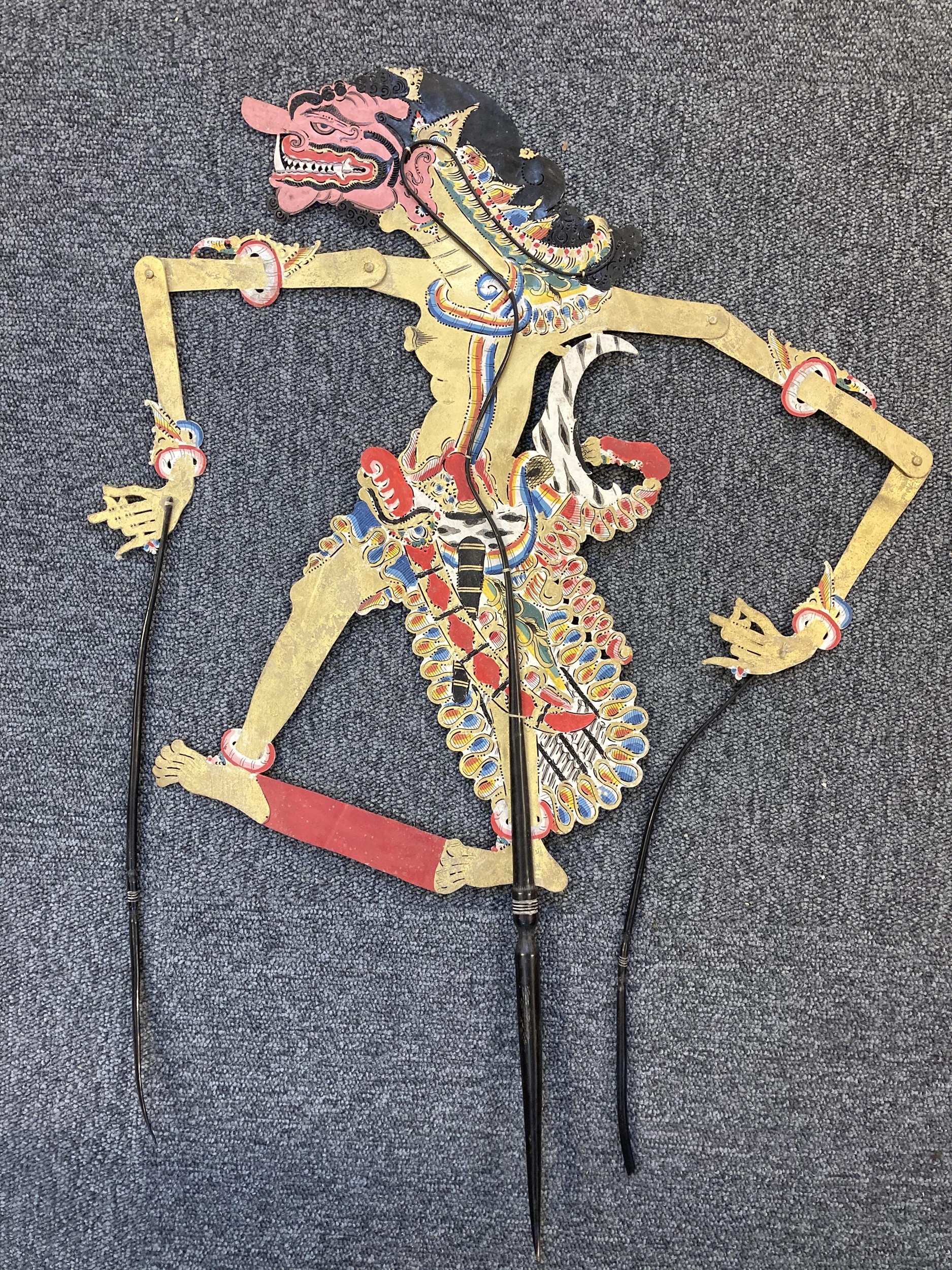 Lot 127 - Shadow puppets. A collection of 4 puppets,