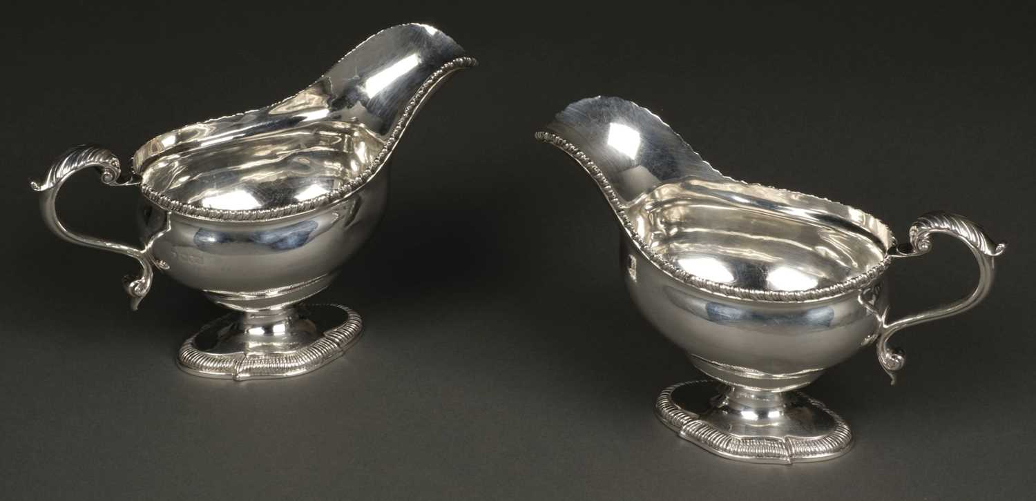 Lot 47 - Sauce Boats. A large pair of George V silver sauceboats