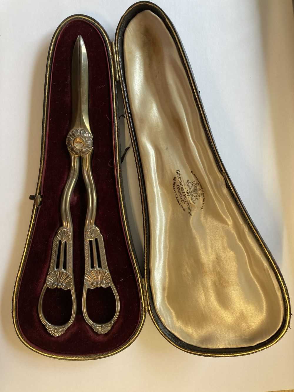 Lot 29 - Grape Scissors. A pair of Edwardian silver grape scissors