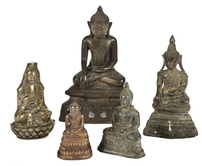 Lot 175 - Tibetan Figures. A collection of brass figures