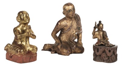 Lot 143 - Buddha's. A gilt gilt metal buddha and others