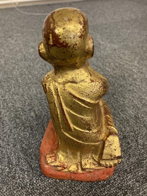 Lot 143 - Buddha's. A gilt gilt metal buddha and others