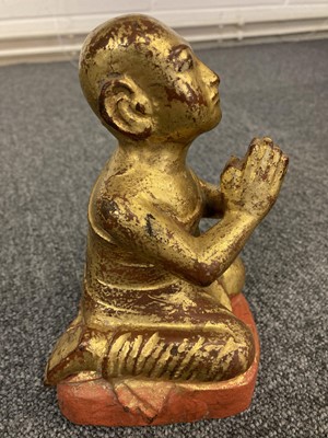 Lot 143 - Buddha's. A gilt gilt metal buddha and others