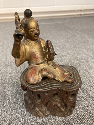 Lot 143 - Buddha's. A gilt gilt metal buddha and others