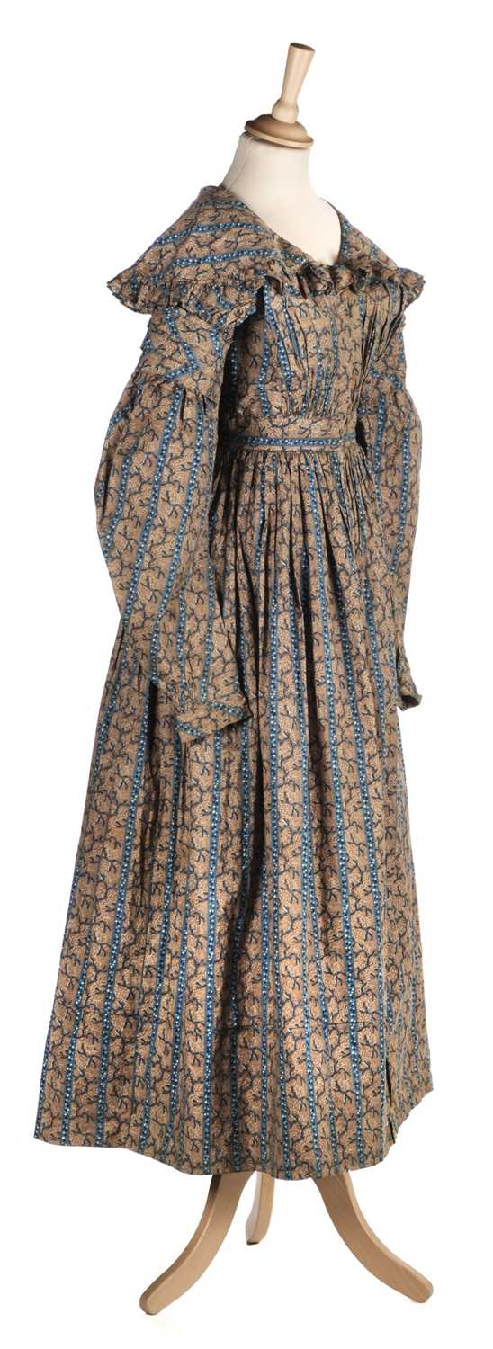 Lot 232 - Clothing. A printed cotton day dress, circa 1840s, & 2 other garments