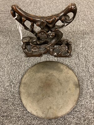 Lot 159 - Chinese. An archaic bronze mirror on a hardwood stand