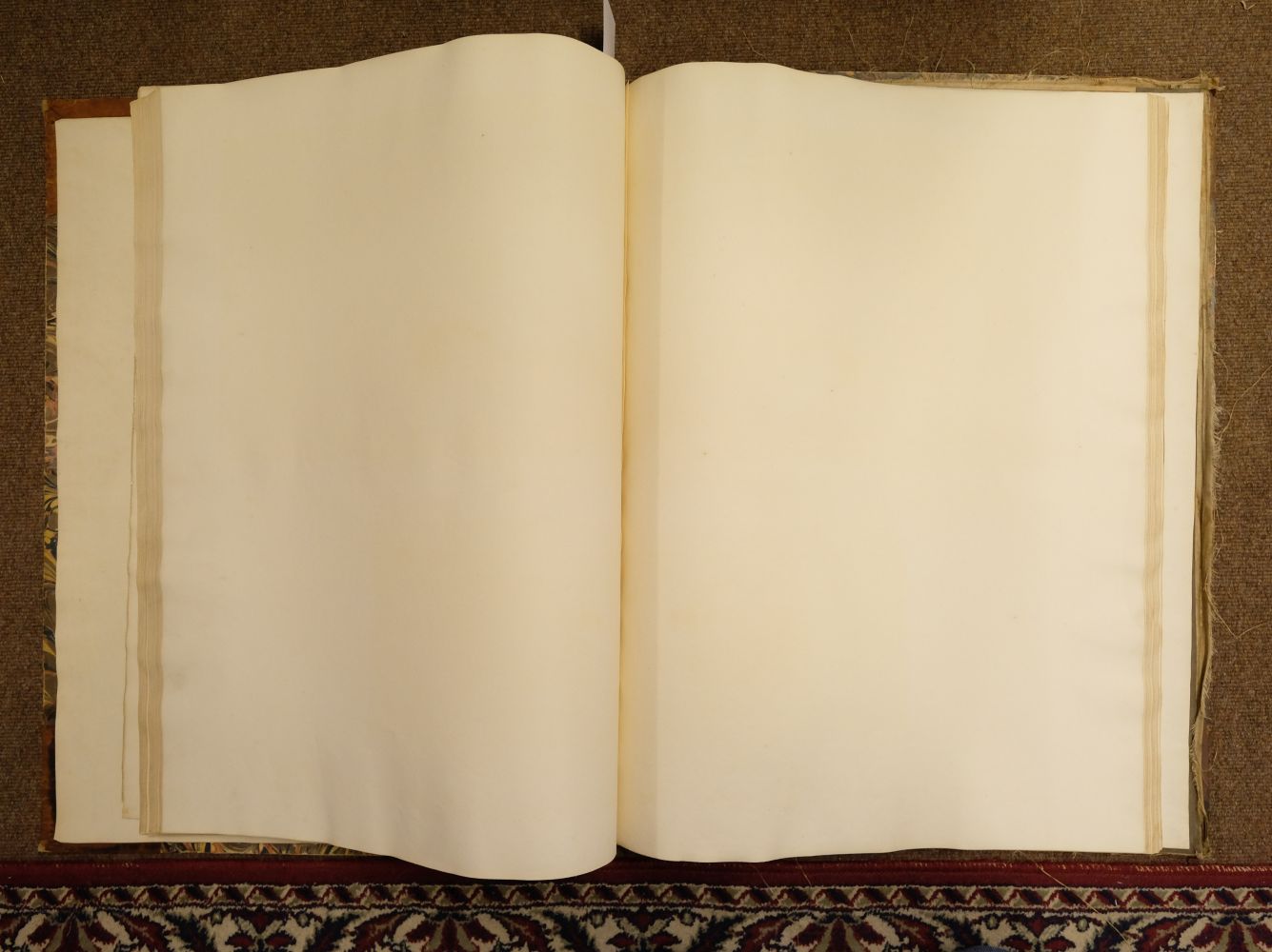 Lot 550 - Paper - Handmade. A folio volume of blank