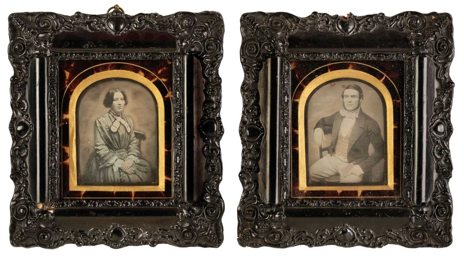 Lot 31 - Daguerreotypes. A pair of hand-tinted daguerreotypes of a seated young woman and young man, c. 1860
