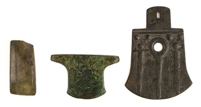 Lot 140 - Axe head. Two Chinese archaic bronze ritual axe head plus a Neolithic tool
