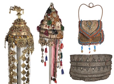 Lot 284 - Tribal. A large belt, possibly Indian, 19th century, plus festival headdresses and a purse