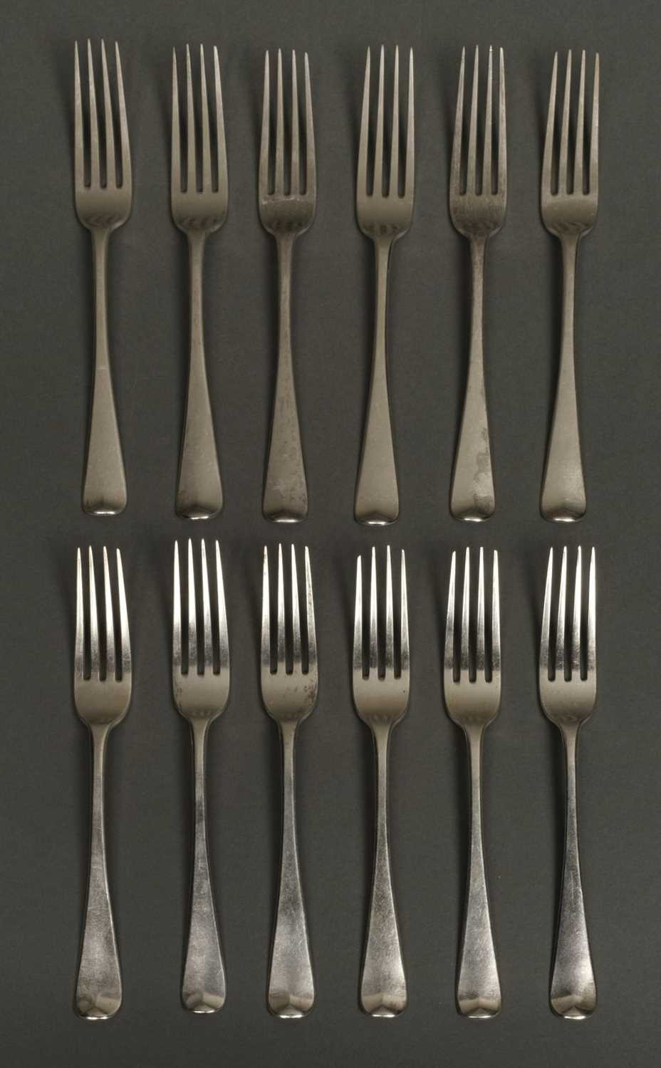Lot 13 - Forks. 12 George III silver table forks by Thomas Wilkes Barber, London 1809