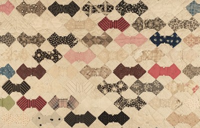 Lot 271 - Quilt.  A Victorian tufted patchwork bowtie quilt, English