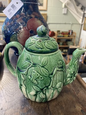 Lot 120 - Majolica. 19th-century pottery wall plaque and teapot