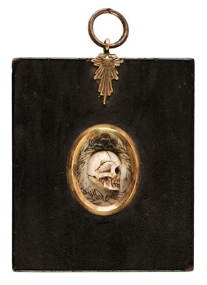 Lot 321 - Memento Mori. An oval miniature carved skull in profile, late 18th century