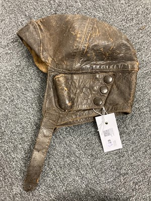 Lot 67 - Flying Helmet. WWI leather flying helmet, goggles and gauntlets