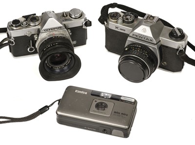 Lot 595 - Olympus OM-1, Pentax K1000 & Konica Big Mini BM-201 cameras with several lenses