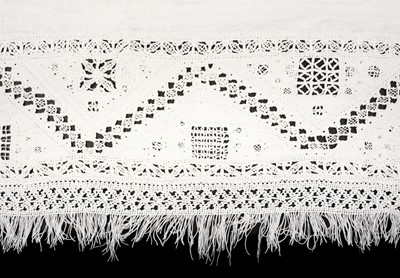 Lot 579 - Lace. A cutwork linen coverlet, probably Italian, late 16th/early 17th century