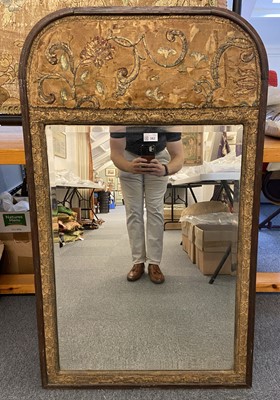 Lot 382 - Embroidered mirror. A mirror set with early embroidery, 1580-1600