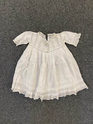 Lot 392 - Infant's clothing. An early child's smock, English, circa 1850, and other children's clothes