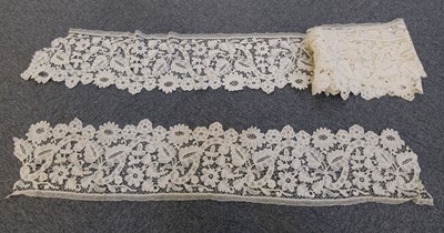 Lot 396 - Lace. A long length of wide tape and needle lace, late 19th century, & other lace items