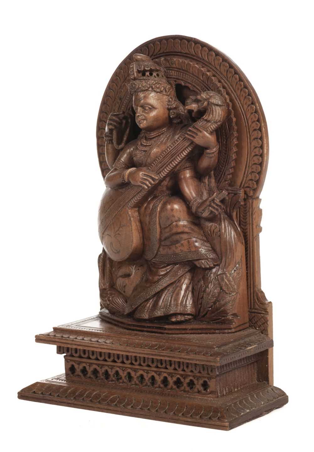 Lot 304 - Deity. An early 20th-century Indian sandalwood carving of a deity
