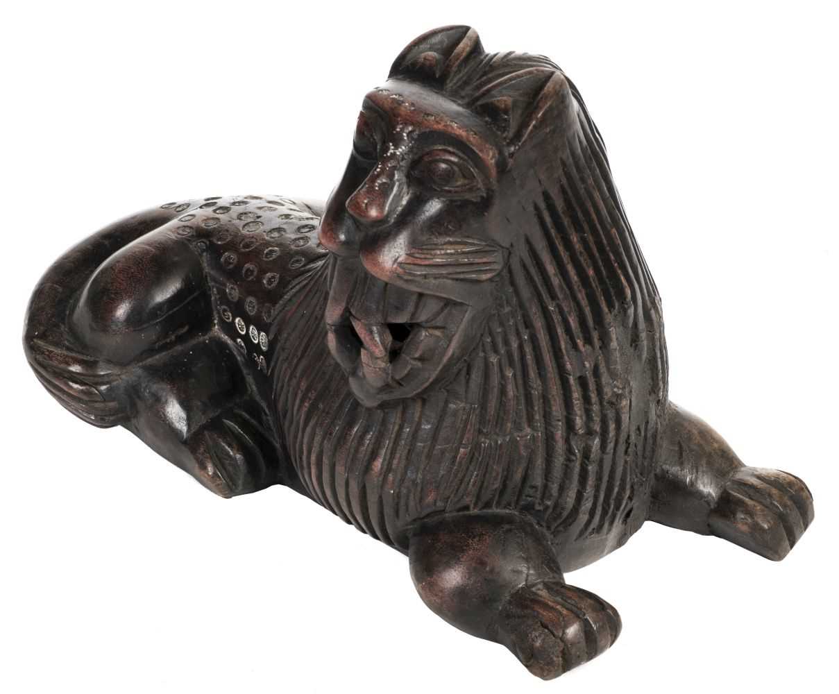 Lot 318 - Benin. A carved wood lion