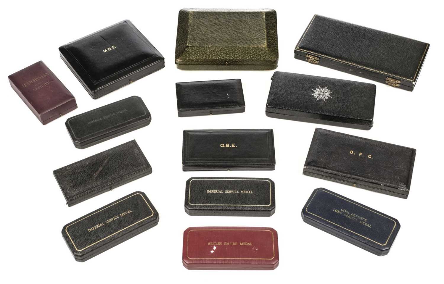 Lot 289 - Medal Cases. A collection of medal cases, including DFC, OBE, MBE