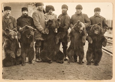 Lot 476 - Bear Hunters. Three photographs of Russian bear hunters with their kills