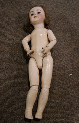 Lot 514 - Dolls. A bisque head doll, French, early 20th century, & other dolls and jigsaws