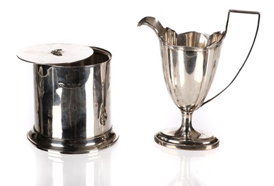 Lot 411 - Cream Jug. An Edwardian silver cream jug and tea canister 

Silver cream jug & lidded container
