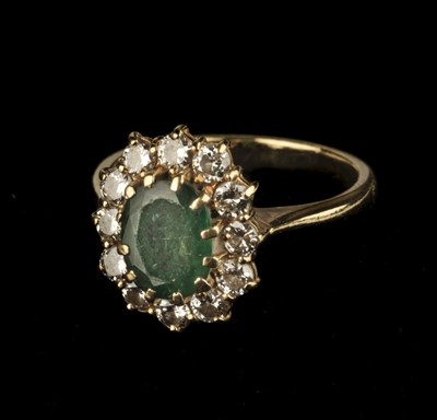 Lot 373 - Emerald Ring. An 18ct gold emerald and diamond cluster ring