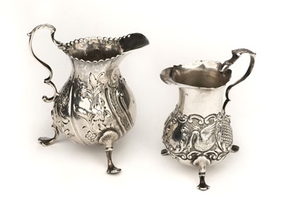 Lot 410 - Cream Jug. A Victorian silver cream jug, Chester 1898 and one other