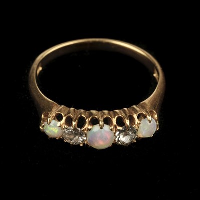 Lot 389 - Opal & Diamond Ring. An 18ct gold opal and diamond ring