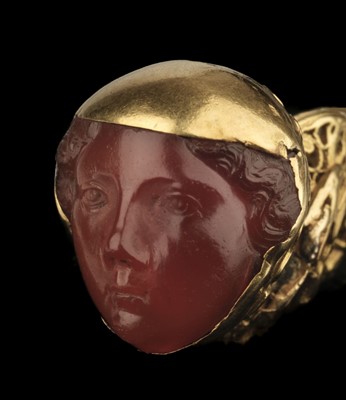 Lot 376 - Fob. An Interesting 19th-century yellow metal fob/pendant with carved carnelian classical head