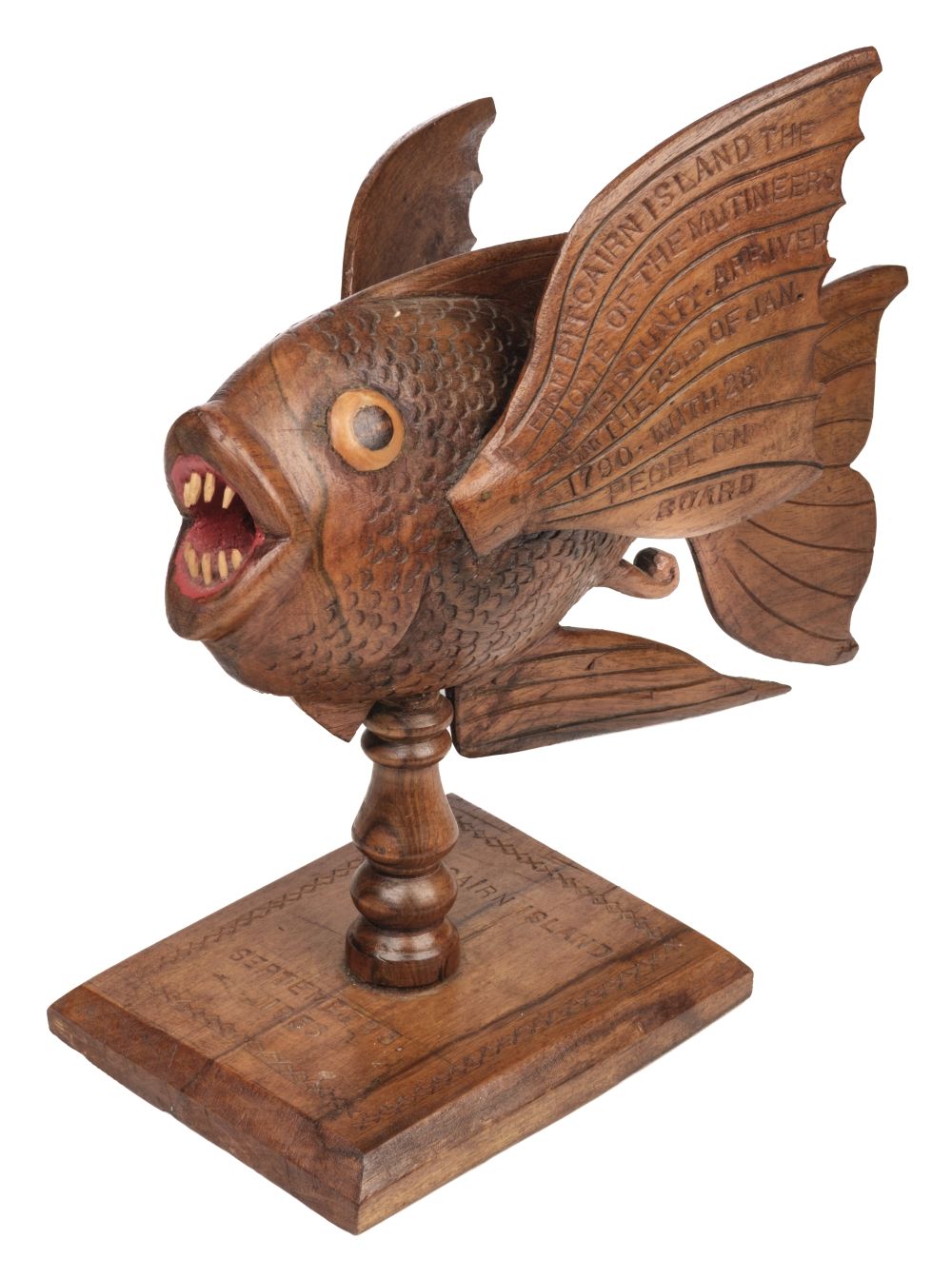 Premium Photo  A carved wooden fish is carved in a wood.