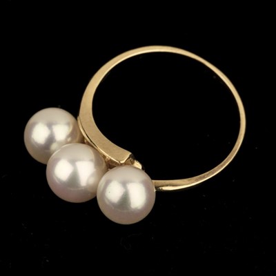 Lot 364 - Akoya Pearl Ring. A 14ct gold triple pearl ring