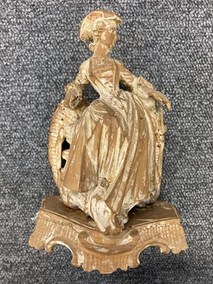 Lot 343 - Rococo Figure. An intriguing Rococo carved wood crinoline lady, probably 18th century